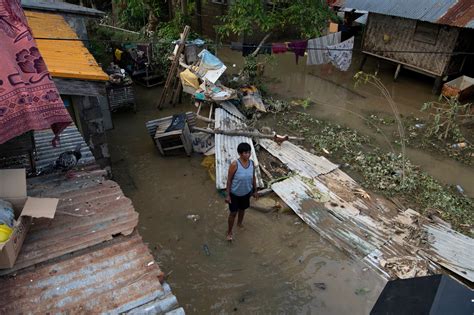 Devastating Floods Submerge the Philippines .